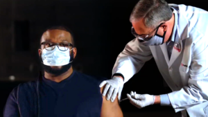 Tyler Perry getting a vaccine shot